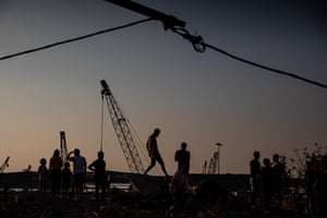 People stop to view the destroyed Beirut port on August 13, 2020 in Beirut, Lebanon.