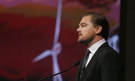 ‘The world is watching you’ ... Leonardo Di Caprio speaks to mayors at the Hotel de Ville in Paris.