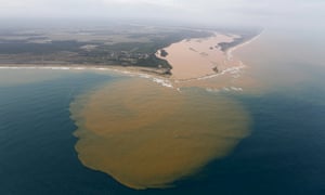 An aerial view of the Rio Doce at an area where the river joins the sea, on the coast of Espírito Santo in Regência village.