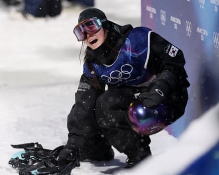 Gaon Choi of South Korea is overcome with emotion after winning gold in the women’s snowboard halfpipe final at the 2026 Winter Olympics