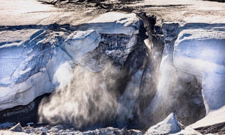 Meltwater flows from the Greenland ice sheet into the Baffin Bay near Pituffik, Greenland, as captured from the ground during a Nasa mission along with University of Texas scientists to measure melting Arctic sea ice.