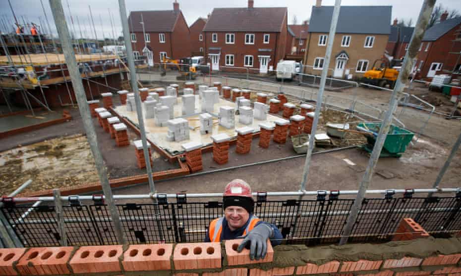 A construction worker lays bricks at a Persimmon residential property construction site in Cranfield.