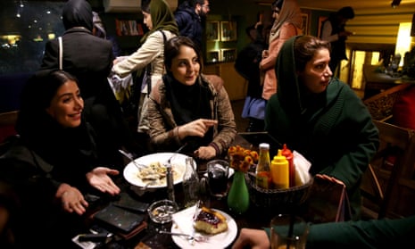 Iranian women at a cafe in central Tehran. Iranians are gearing up for sanctions to be lifted within months.