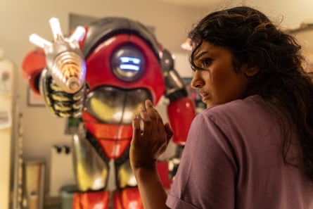 A robot menaces actor Varada Sethu.