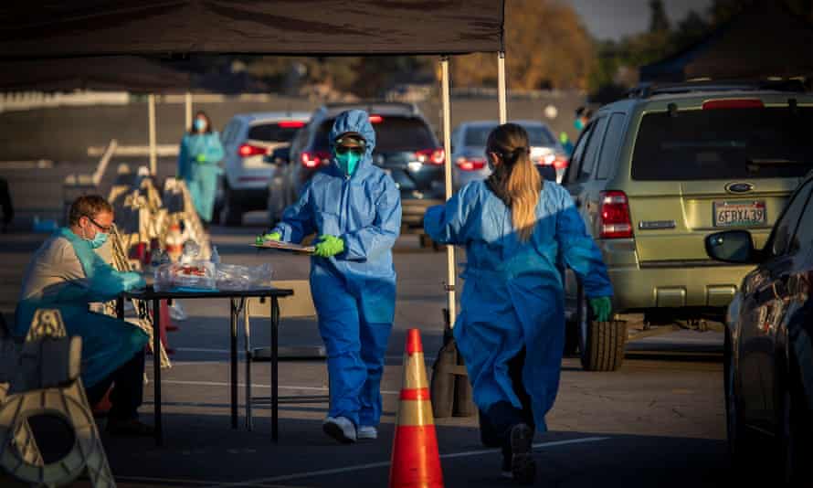 Healthcare workers hand out Covid-19 tests at Long Beach City College-Veterans Memorial Stadium on Wednesday, 9 December 2020.