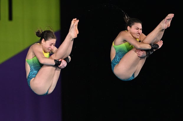 Charli Petrov and Melissa Wu dive for gold.
