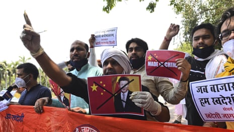 Indian protesters burn effigies of President Xi after China border clash – video