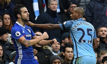 Fernandinho, right, starts to grab and push Chelsea’s Cesc Fàbregas, leading to a red card for the Manchester City man