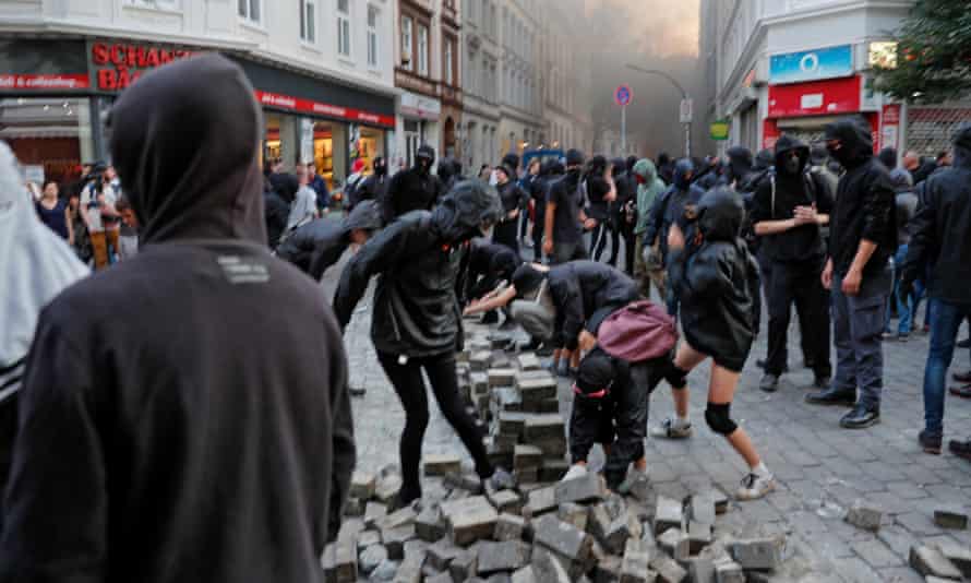 Rioters collect stones in Schanzenviertel quarter in the St. Pauli district during the G-20 summit in Hamburg, Germany.