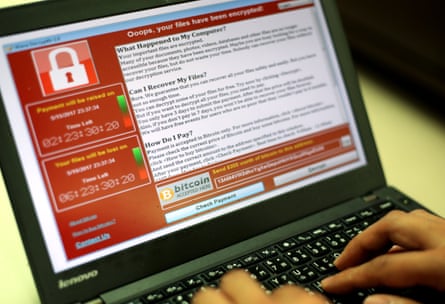 A message demanding payment seen on a laptop after a ransomware cyberattack .
