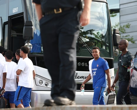 Kylian Mbappe walks towards a bus after a training session in Boston.
