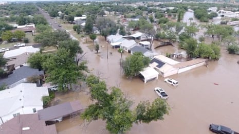 A drone view shows flooded houses in San Angelo, Texas.