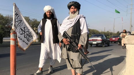 Kabul falls to the Taliban as thousands of Afghans try to flee – video report 