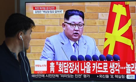 A man watches North Korean leader Kim Jong-un in Seoul on 21 April 2018. 