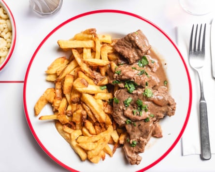 Steak and meat on a plate at a French restaurant in Paris - Bouillon Republique