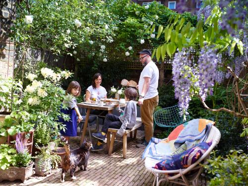 Family sitting round table in garden
