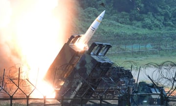 A missile is launched out of a mobile carrier.