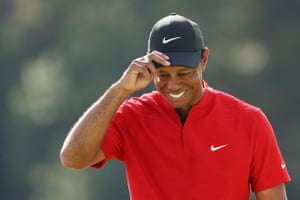 Tiger Woods reacts after finishing on the 18th green