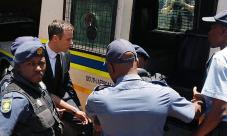 Oscar Pistorius enters a police van after his sentencing at the North Gauteng High Court in Pretoria.