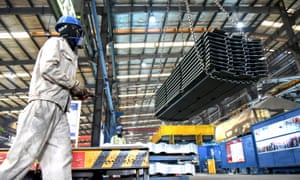 A worker transferring materials at a factory in Lianyungang in China’s eastern Jiangsu province.