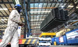 A worker transfers materials to a factory in Lianyungang, eastern Jiangsu province of China.