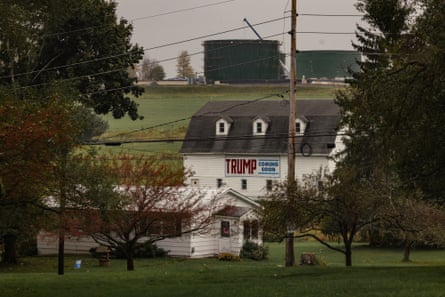 A farmhouse with a Trump sign on it.