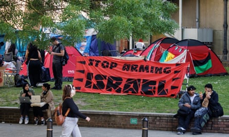 Tents, students and a sign saying ‘stop arming Israel’.