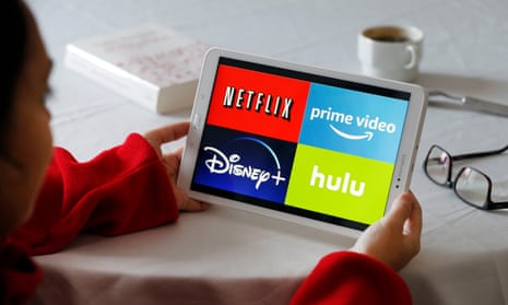 a tablet screen with the logos of disney+, netflix, prime video and hulu