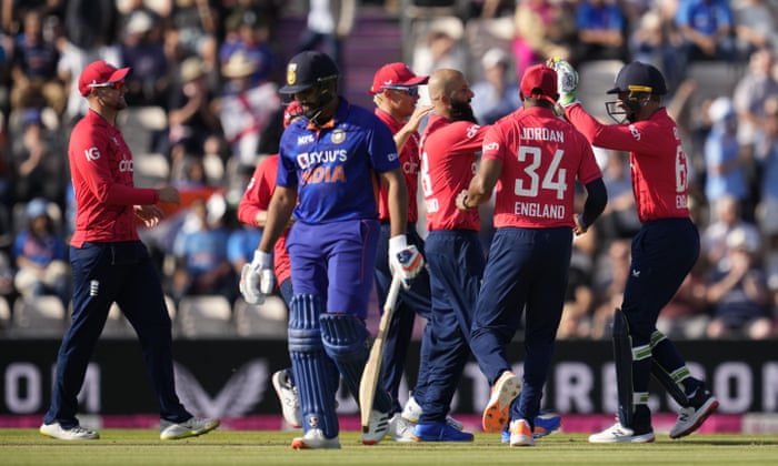 India captain Rohit Sharma walks off the field of play after losing his wicket from the bowling of England’s Moeen Ali (third right), who is congratulated by his team-mates.