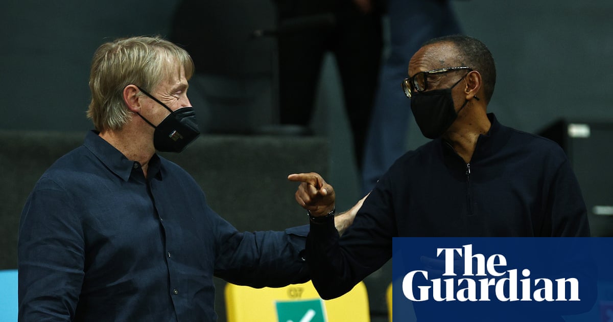 Adam Silver smiles courtside with Paul Kagame, as long as the sanctions only apply to the guys with guns and not the guys buying jersey sponsorships.