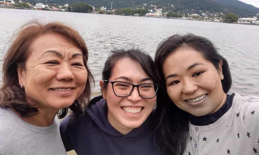 Adriana Midori Takara, centre, with her godmother Kioko Takara, left, and cousin Daniela Sayuri Takara.