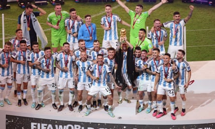 Lionel Messi lifts the World Cup as his Argentina teammates celebrate