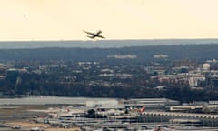 US-AVIATION-TELECOMMUNICATION<br>A passenger aircraft takes off from Ronald Reagan National Airport in Arlington, Virginia, on January 18, 2022, as seen from Washington, DC. - The chief executives of the largest US airlines warned of a "catastrophic disruption" to travel and shipping operations if telecommunication firms roll out their 5G technology as planned on January 19 without limiting the technology near US airports. Verizon and AT&amp;T have already twice delayed the launch of their new C-Band 5G service, due to warnings from airlines and aircraft manufacturers concerned that the new system might interfere with the devices planes use to measure altitude. (Photo by Stefani Reynolds / AFP) (Photo by STEFANI REYNOLDS/AFP via Getty Images)