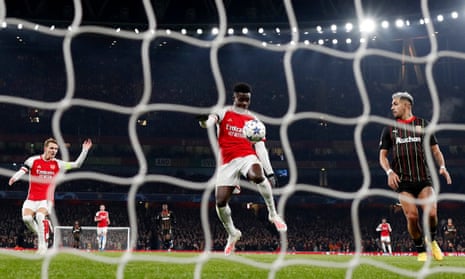 Arsenal's Bukayo Saka scores their third goal against Lens.