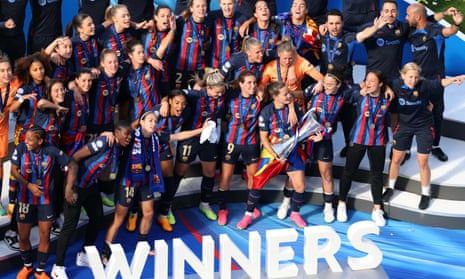Barcelona's players celebrate with the trophy after winning the UEFA Women's Champions League