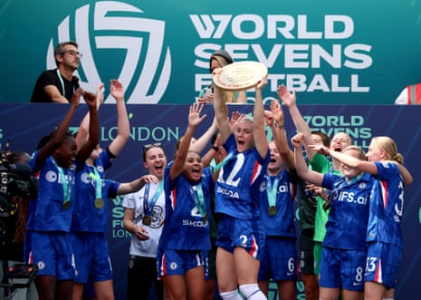 Chelsea’s Ellie Carpenter celebrates with the trophy following the World Sevens Football final between Chelsea and Manchester United at the Gtech Community Stadium