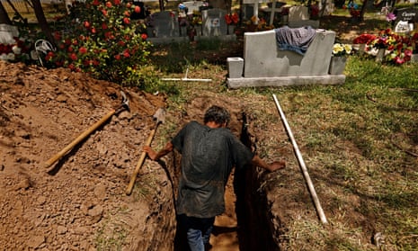 Jesus Torres, age 75, was hired to dig graves after the backhoe broke down at La Piedad cemetery in McAllen, Texas this July.