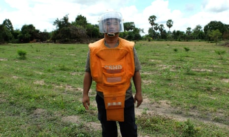 Aki Ra wearing mine-clearing protection gear.