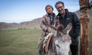 Baddiel with a local boy in a nomad village in Kyrgyzstan.