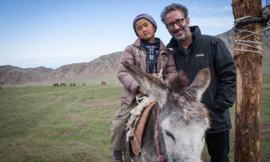 Baddiel with a local boy in a nomad village in Kyrgyzstan.
