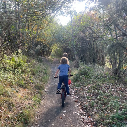 Sachin cycling through the reserve towards the bird hide.
