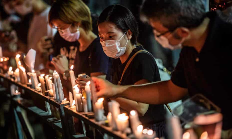 People in Hong Kong attend a candlelit vigil at Victoria park in 2020 to mark the 1989 Tiananmen Square massacre. Such events could now fall foul of the national security law.