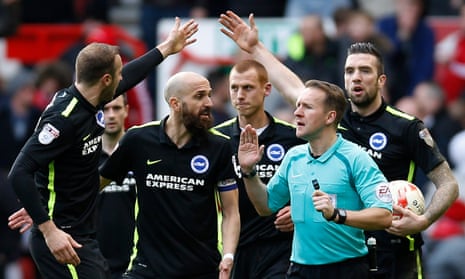 Brighton’s players argue with the referee Oliver Langford after Nottingham Forest’s controversial first goal, scored by Zach Clough