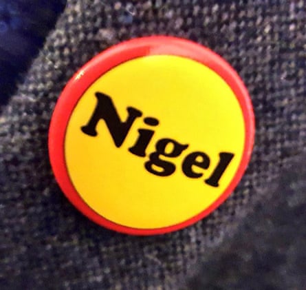 A brightly coloured button reading ‘Nigel’.