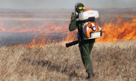 Local volunteer Andrey Polomoshnov suppresses grass fires in Zabaikalsky region, Siberia, Russia.