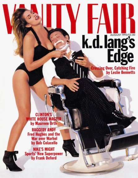 Magazine cover featuring Cindy Crawford shaving kd lang’s chin in a barber’s chair