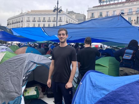 David Iglesias standing between tents