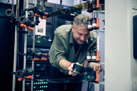 Dan Drobik working with the reel of film of the Odyssey