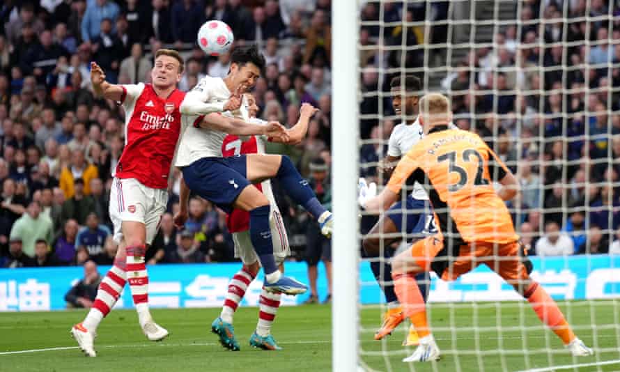 A challenge on Tottenham Hotspur’s Son Heung-min by Arsenal’s Cedric (rear) leads to a penalty.