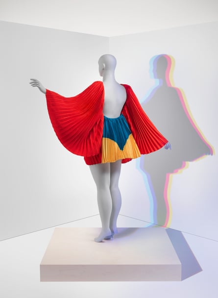 bright, bold colors on dress with wing-like red sleeves